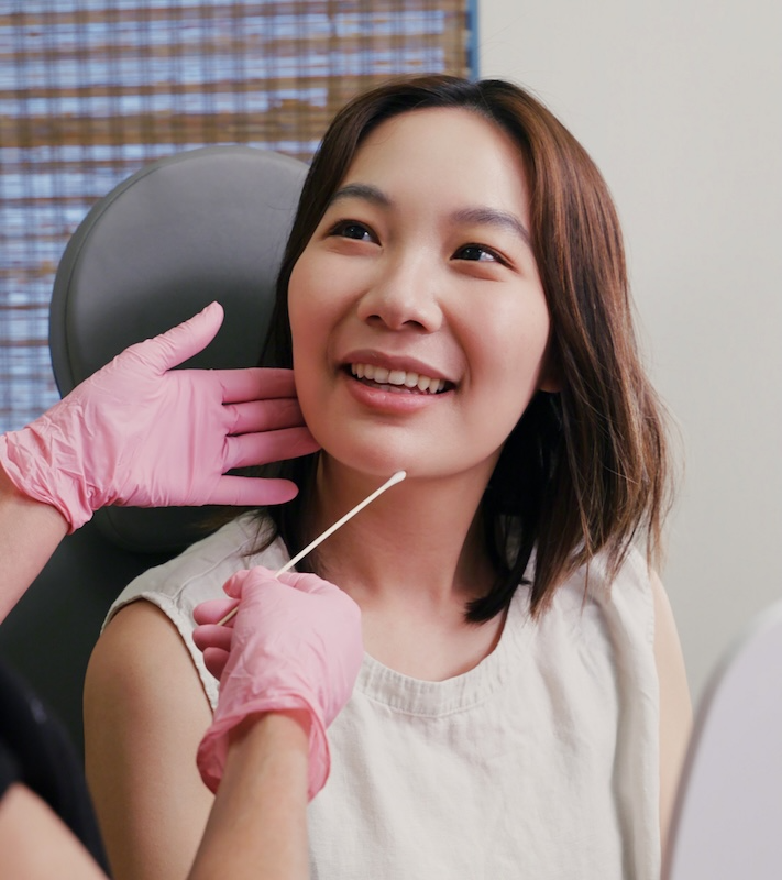 woman receiving facial consultation at glow houston