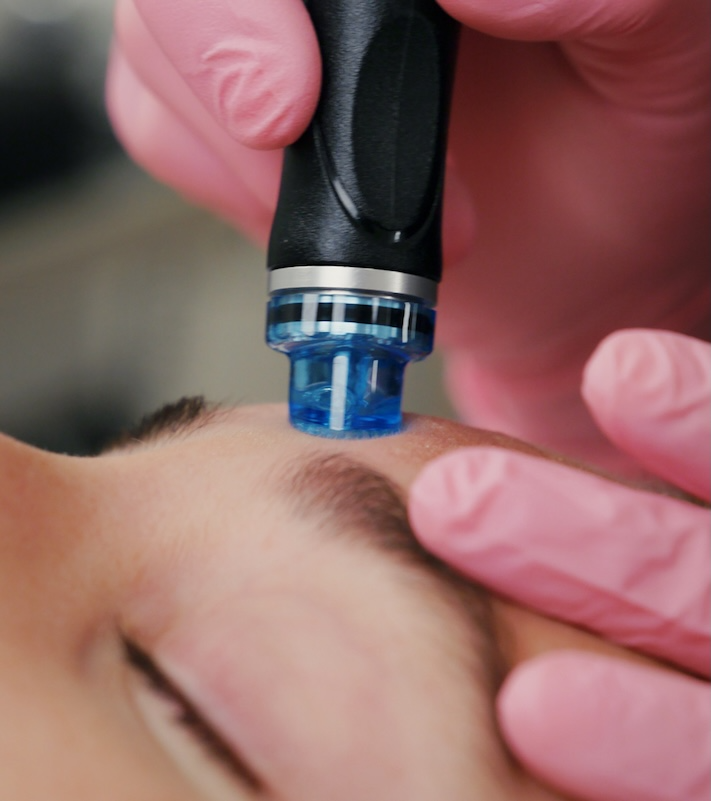 woman receiving facial treatment at glow houston2