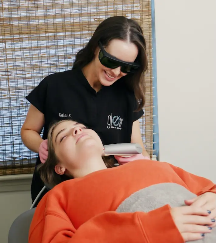 woman receiving facial treatment at glow houston3